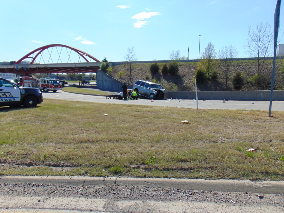 U.S. Capitol Police officers stand near a car that crashed into a barrier on Capitol Hill in Washington, Friday, April 2, 2021. (AP Photo/J. Scott Applewhite)