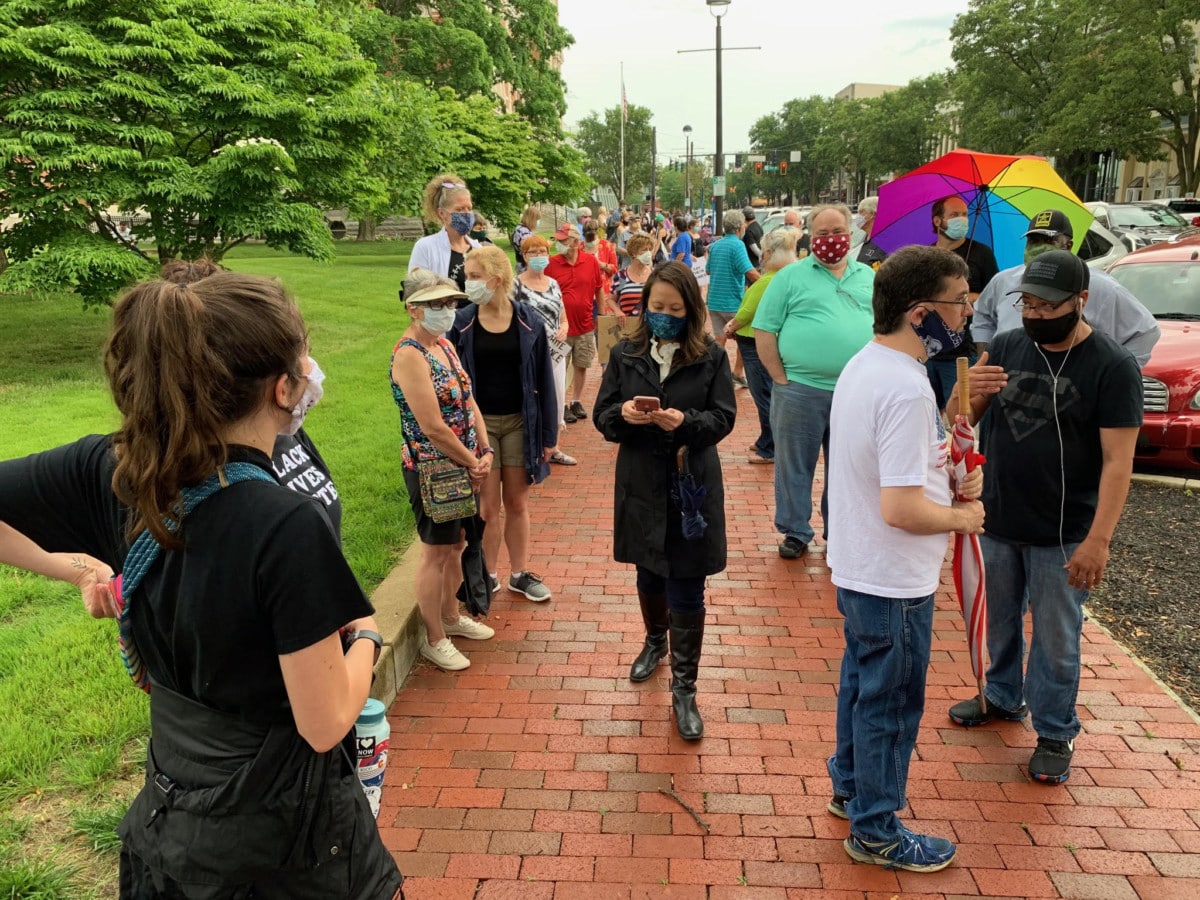 People start to gather for a solidarity rally to support families of African American victims of police brutality. The rally begins at noon at Columbus City Hall. Photo by Mike Wolanin