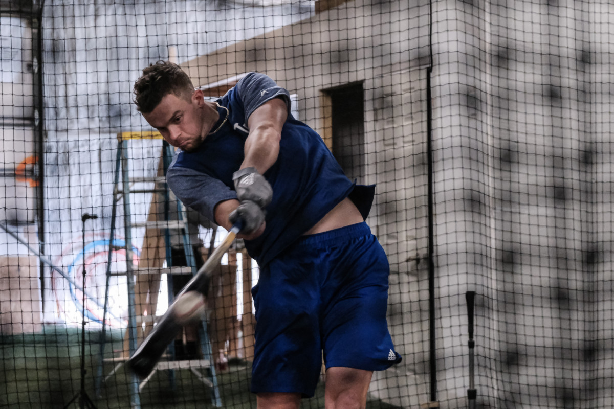 Former Columbus North baseball player Devin Mann hits a ball during batting practice at HIT Baseball in Columbus, Ind., Friday, Jan. 22, 2021. He has been bouncing around the Dodgers' minor league system since being selected by the team in the fifth-round of the 2018 draft. Mike Wolanin | The Republic