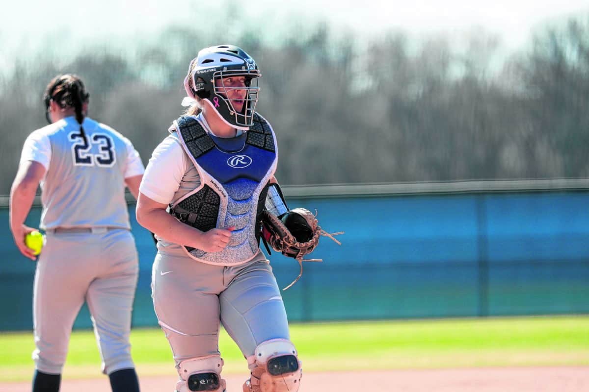Columbus East graduate Elyse Babb makes her way back to the plate after a visit with her pitcher for Butler against Illinois-Chicago March 27, 2019.  Brent Smith | Butler Athletics
