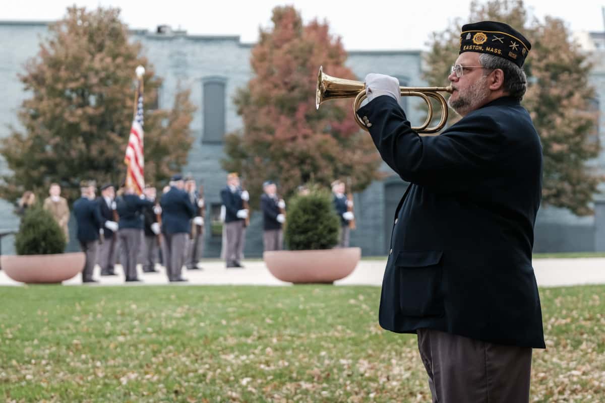 Charles Reynolds, a member of the Bartholomew County Veterans Honor Guard, plays Taps during the annual Veteran's Day program at Columbus City Hall in Columbus, Ind., Monday, Nov. 11, 2019. Mike Wolanin | The Republic