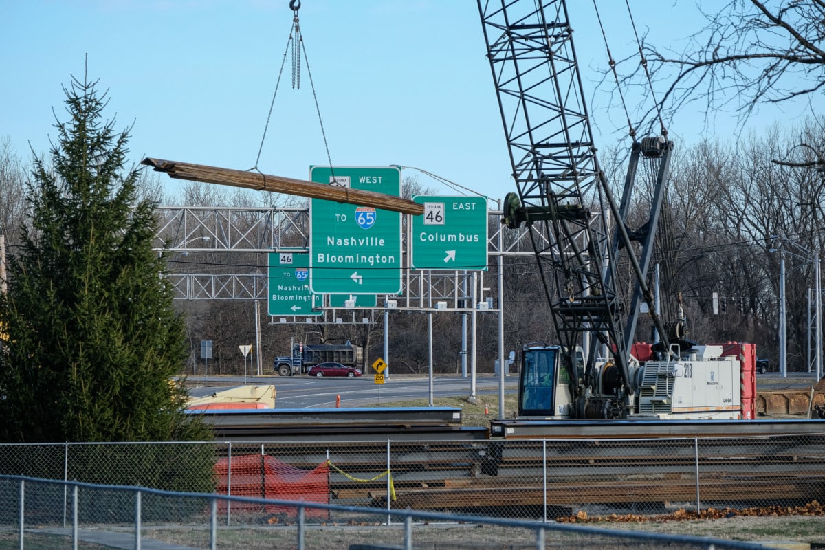 Construction crews work on the train overpass at the intersection of Jonesville Road and Jonathon Moore Pike in Columbus, Ind., Wednesday, Dec. 4, 2019. Mike Wolanin | The Republic