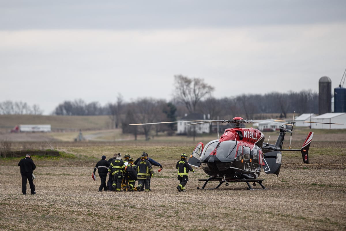 First responders take the driver of an SUV involved in a collision with a train to a LifeLine helicopter in Edinburgh, Ind., Friday, March 6, 2020. Mike Wolanin | The Republic
