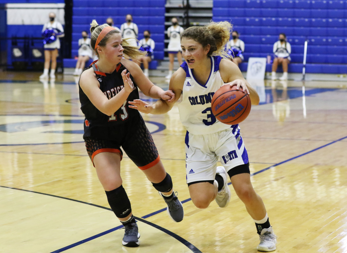 Columbus North's Lauren Barker brings the ball down the court while being guarded by Lawrenceburg's Hannah White at Columbus North, Saturday, Jan. 16, 2021. Paige Grider for The Republic