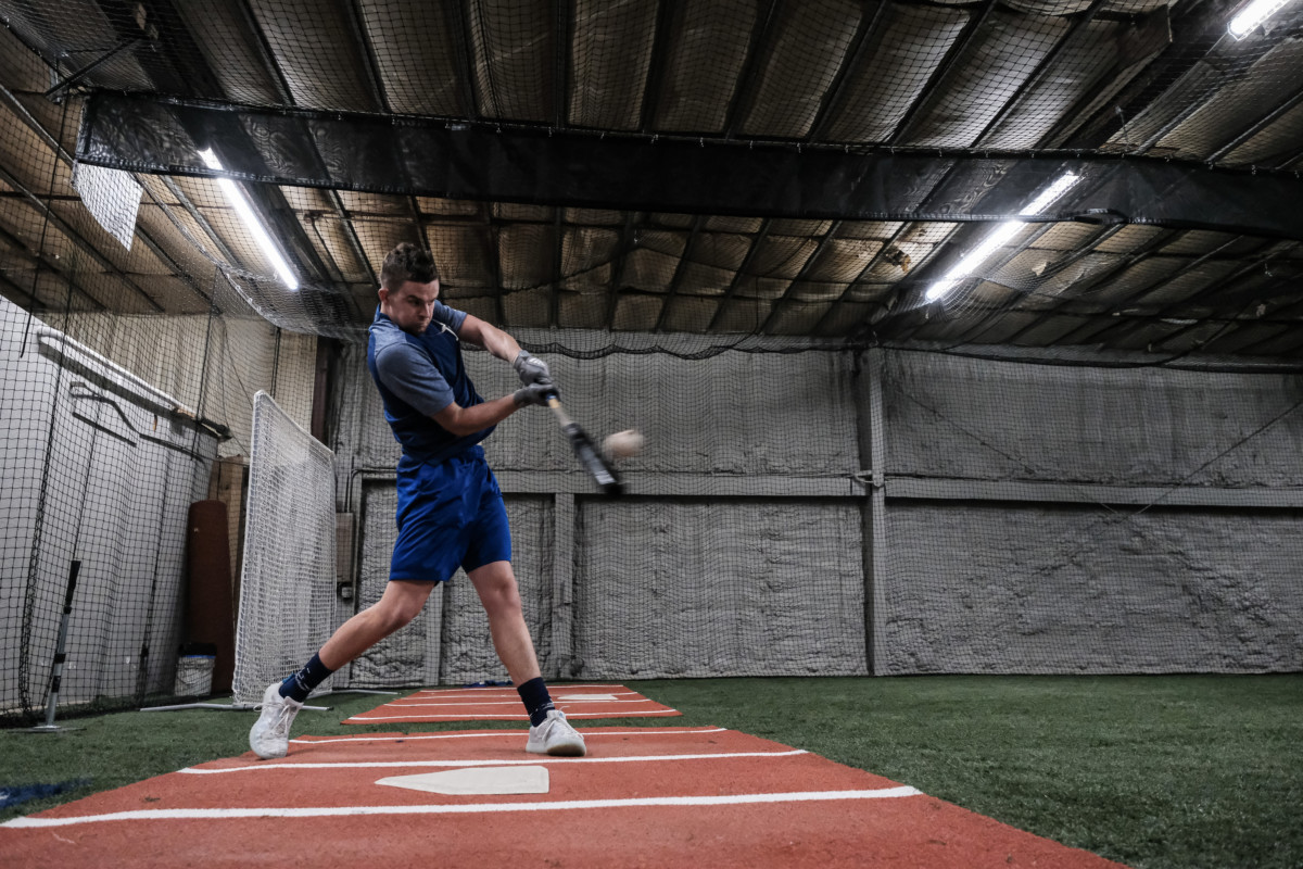 Former Columbus North baseball player Devin Mann hits a ball during batting practice at HIT Baseball in Columbus, Ind., Friday, Jan. 22, 2021. He has been bouncing around the Dodgers' minor league system since being selected by the team in the fifth-round of the 2018 draft. Mike Wolanin | The Republic