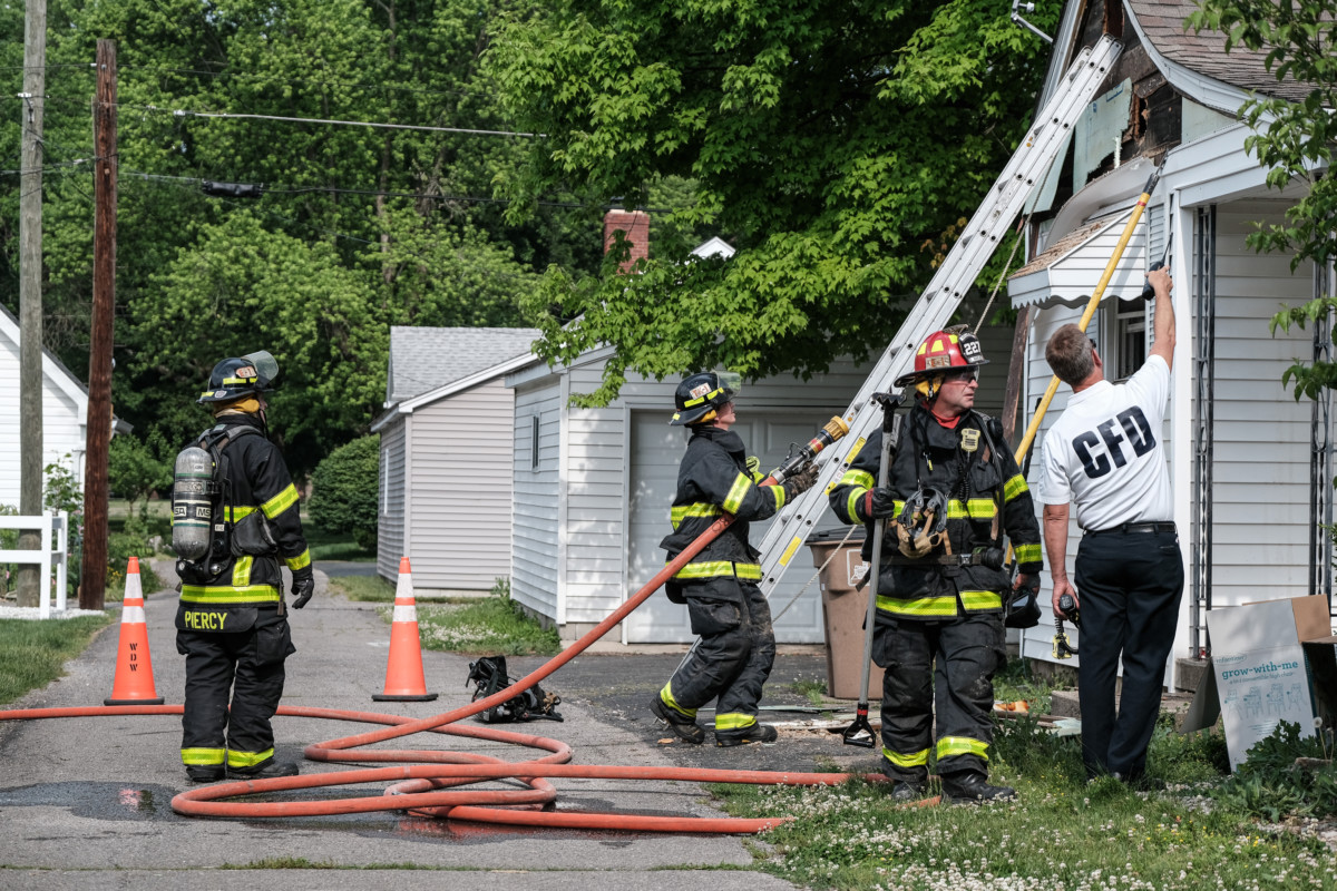 Columbus firefighters respond to a small structure fire on California Street in Columbus, Ind., Monday, May 24, 2021. Mike Wolanin | The Republic