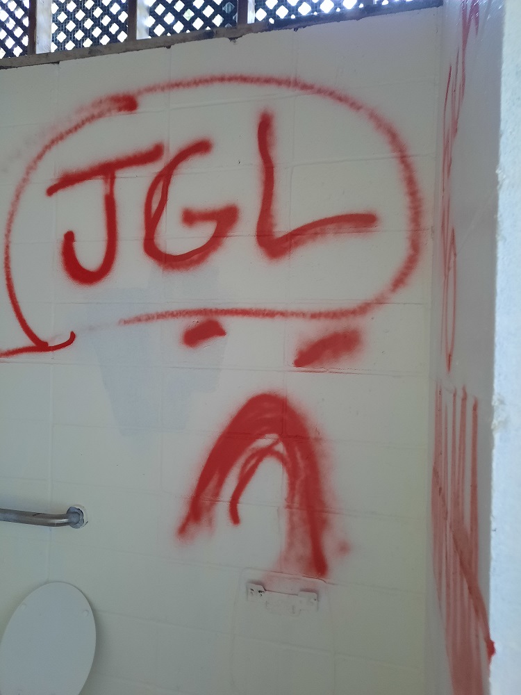 JGL in slang terms means just get lost but it is undetermined what the message was in this spray paint from the vandals at the Anderson Falls restrooms, which were under renovation. Photo provided