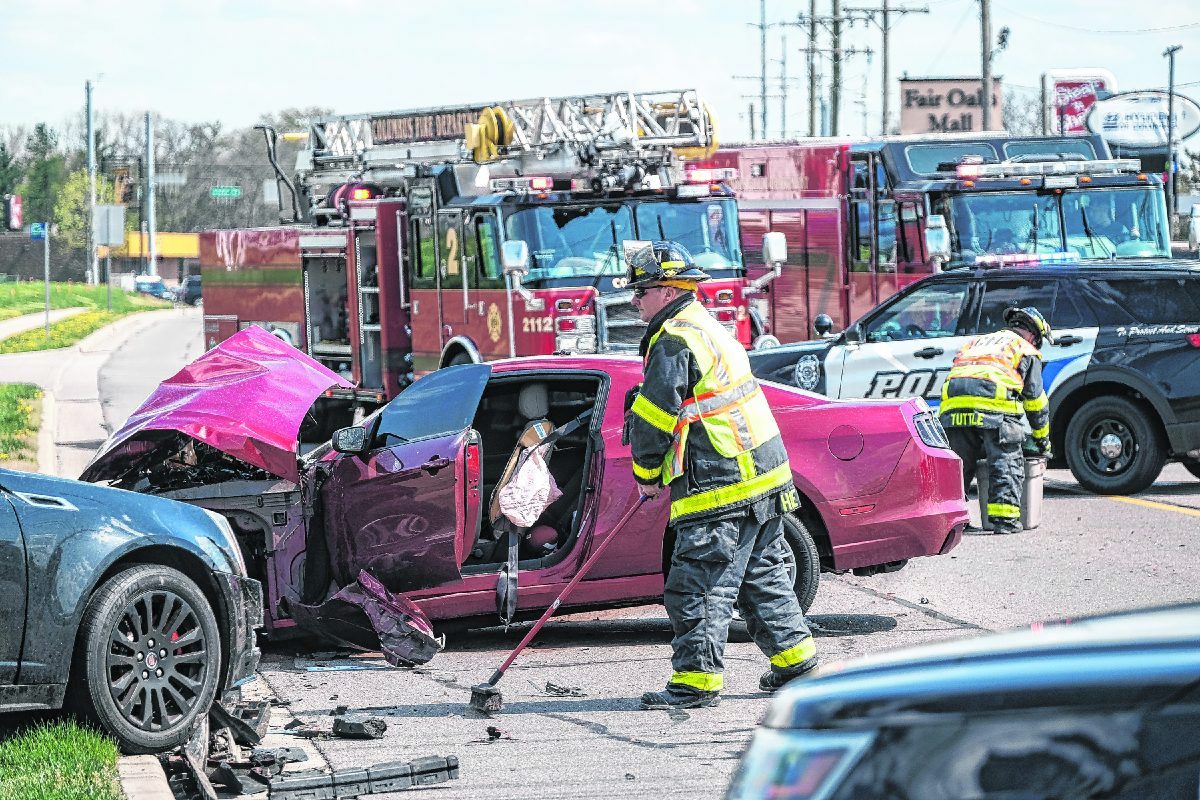 Columbus police and firefighters work the scene of an accident after a high speed chase that ended in a crash on National Road in Columbus, Ind., Friday, April 9, 2021.Mike Wolanin | The Republic  Mike Wolanin | The Republic