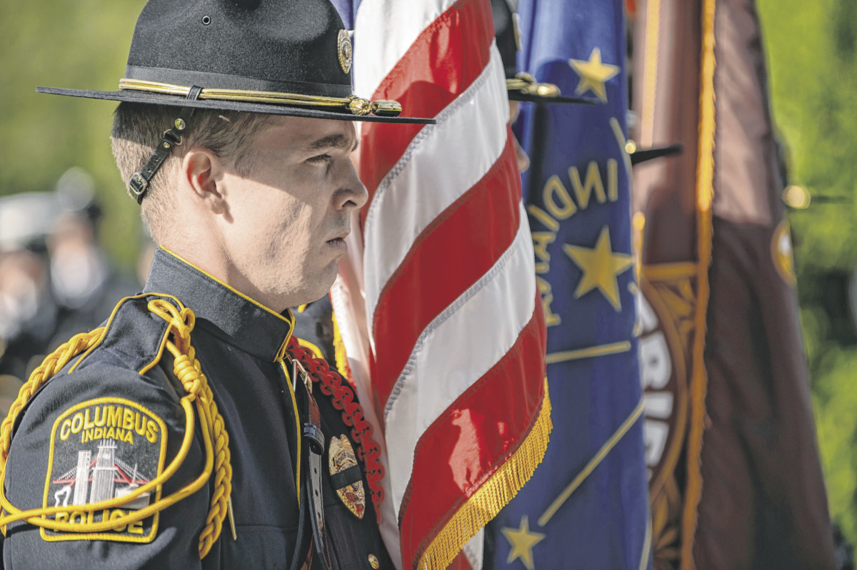 Columbus Police officer Lukas Nibarger stands as a member of the color guard during a memorial service to honor law enforcement officers killed in the line of duty at Public Safety Plaza in Columbus, Ind., Friday, May 17, 2019. Mike Wolanin | The Republic