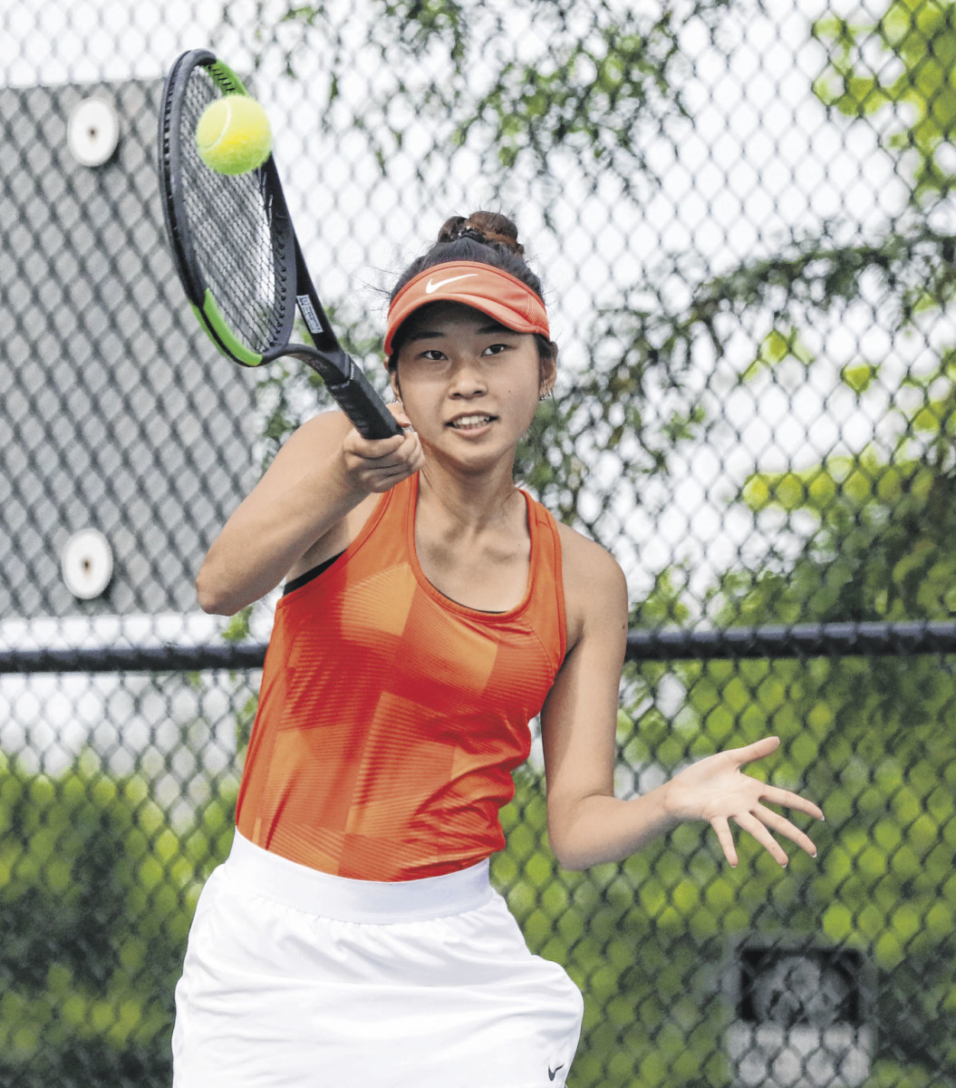 Columbus East's Ayano Nomura makes contact with the ball during the sectional final at Columbus North, Friday, May 17, 2019. Paige Grider for The Republic