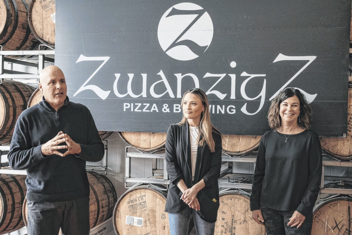 Kurt Zwanzig, from left, co-owner of ZwanzigZ Pizza and Brewing, ZwanzigZ communications and events specialist Caroline Letsel, and Lisa Zwanzig, co-owner of ZwanzigZ Pizza and Brewing, address guests during their Columbus Craft Beer Festival Charity Lunch at ZwanzigZ Brewery on 12th Street in Columbus, Ind., Friday, Jan. 10, 2020. Lisa and Kurt presented checks in the amount of $7,000 to Columbus Parks and Recreation, Turning Point and Just Friends Adult Day Services. Mike Wolanin | The Republic