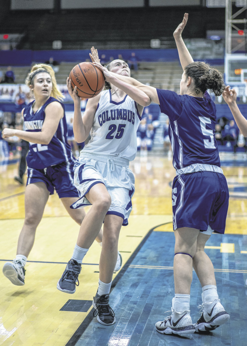Columbus North's Madison White is fouled by Bloomington South's Kendall Harmon, at Columbus North, Saturday, January 11, 2020. Tim Sorrells | For The Republic