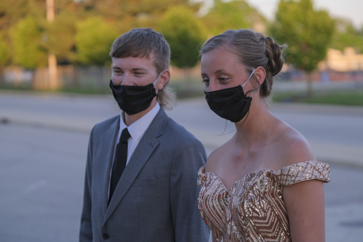 Columbus North student Alana Cook, right, and her prom date Ethan Rouse make their way to prom at Northside Middle School in Columbus, Ind., Saturday, May 1, 2021. Mike Wolanin | The Republic