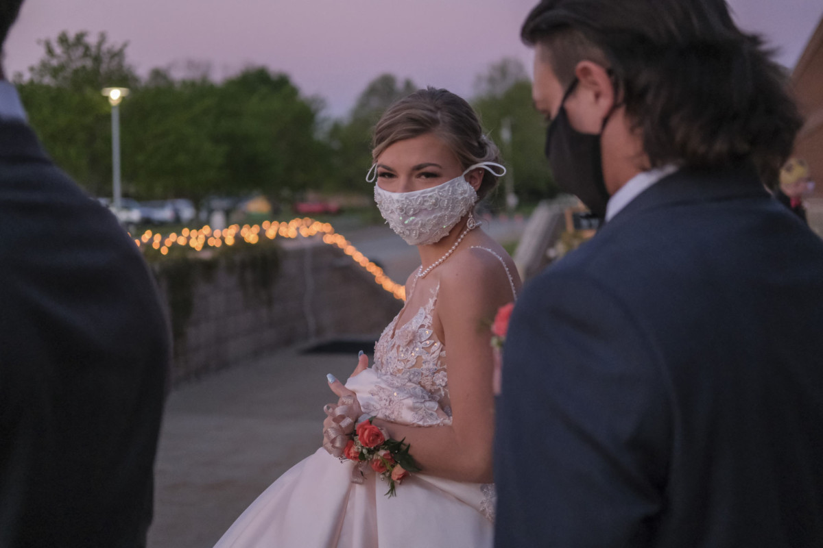 Columbus North students Chole Roberts, left, and Adler Yentz arrive at prom at Northside Middle School in Columbus, Ind., Saturday, May 1, 2021. Mike Wolanin | The Republic
