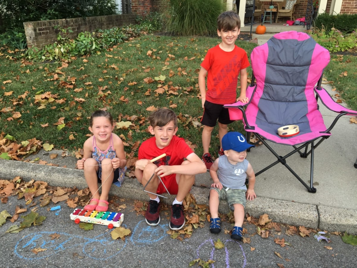 A musical group playing along Franklin Street.