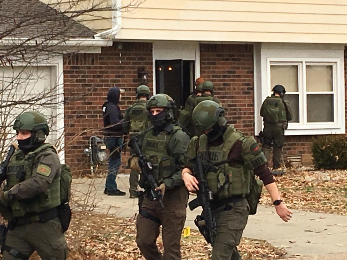 The Joint Narcotics Enforcement Team assisted by the Columbus Police Department SWAT team, search an appartment at 3244 Sycamore Court. Photo provided