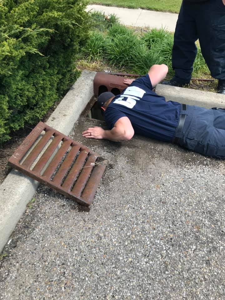 Columbus firefighters check for the location of the birds in the storm drain. Photo provided