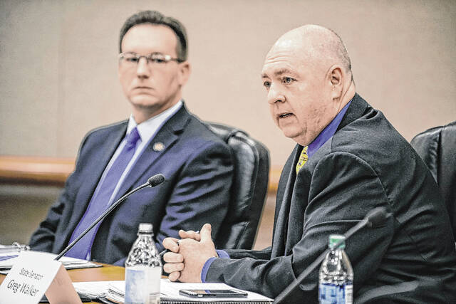 128120479_web1_20211220cr-lauer-walker-together-2