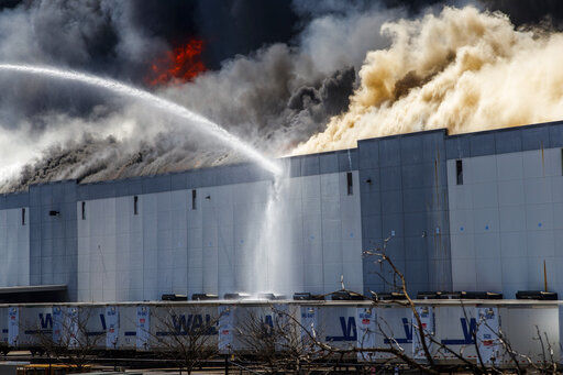 Firefighters still putting out 'hot spots' at Walmart warehouse fire in ...