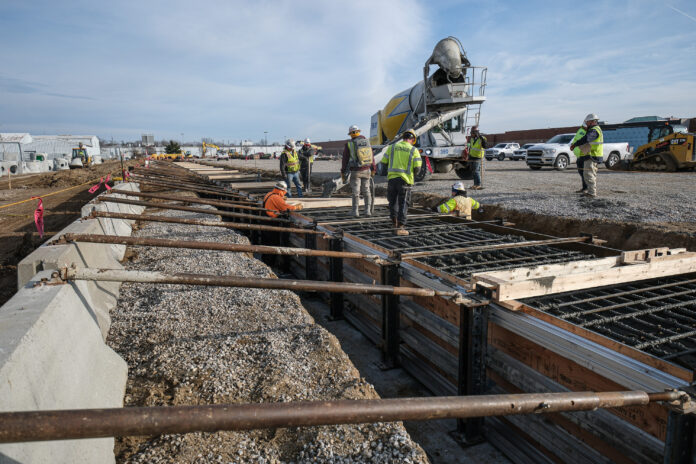 Concrete being poured for indoor sports fieldhouse at NexusPark site