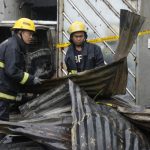 Rain and a wrong address delayed firefighters reaching a Philippine factory blaze. 15 people died
