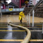 2 dead in Hong Kong amid extreme rain and flash floods that also struck southern China