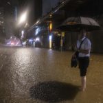Hong Kong closes schools as torrential rain floods streets, subway station