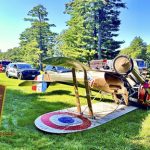 World War I-era plane flips onto roof trying to land near Massachusetts museum; pilot unhurt