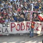 Migrant caravan in southern Mexico marks Christmas Day by trudging onward