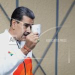 Venezuelans vote in a referendum to claim sovereignty of a large territory under dispute with Guyana