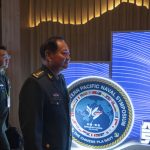 Chinese general takes a harsh line on Taiwan and other disputes at an international naval gathering