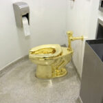 Men who stole $6 million golden toilet from English mansion sentenced to prison terms