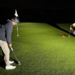 Flashlights and glowing golf balls. How a NY man played for 35 hours in quest for world record
