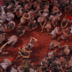 Tons of overripe tomatoes become projectiles in Spain’s ‘Tomatina’ food fight