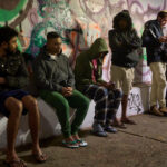 The Latest: Iran retaliates against Gulf energy sites as stocks sink worldwide