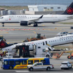 Mangled plane in LaGuardia crash is towed from runway as most injured passengers leave hospital